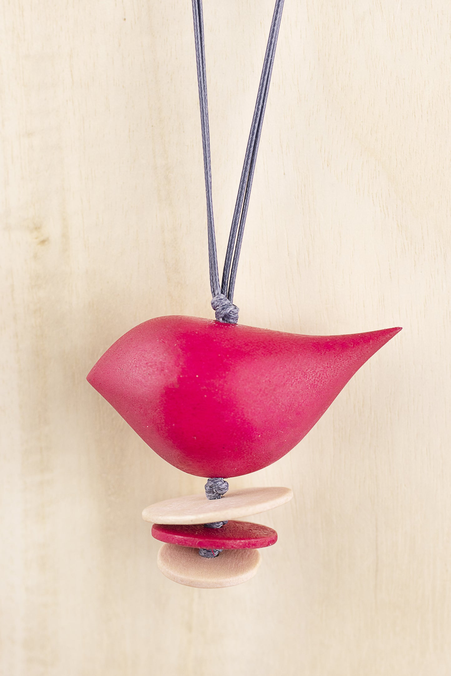 Wooden pendant with bird