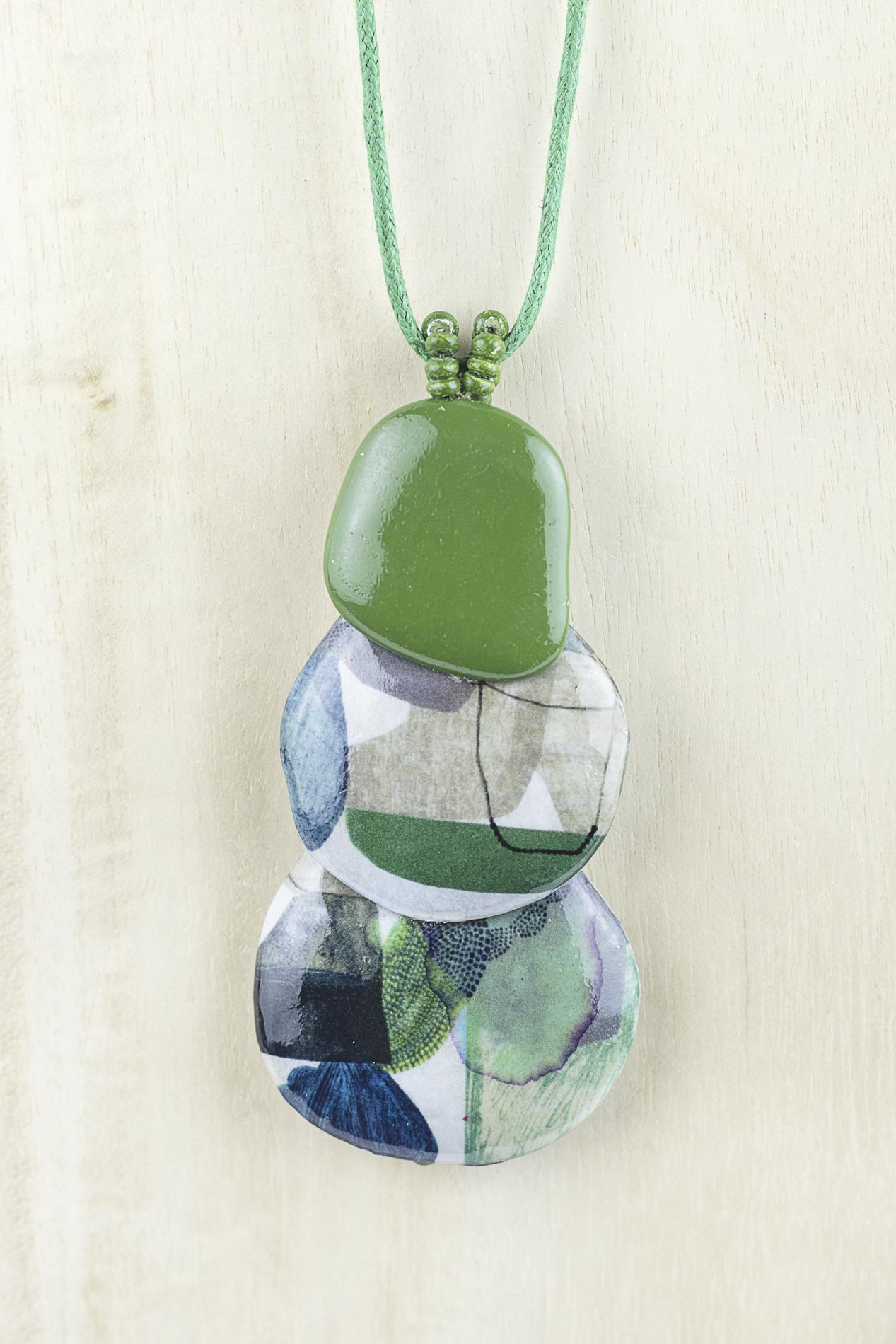 Pendant with three organically shaped pieces