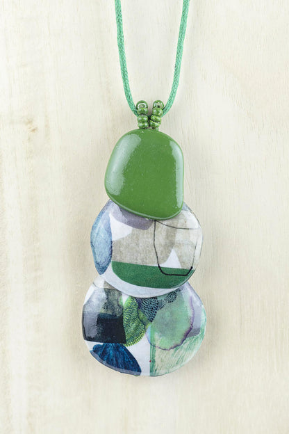 Pendant with three organically shaped pieces