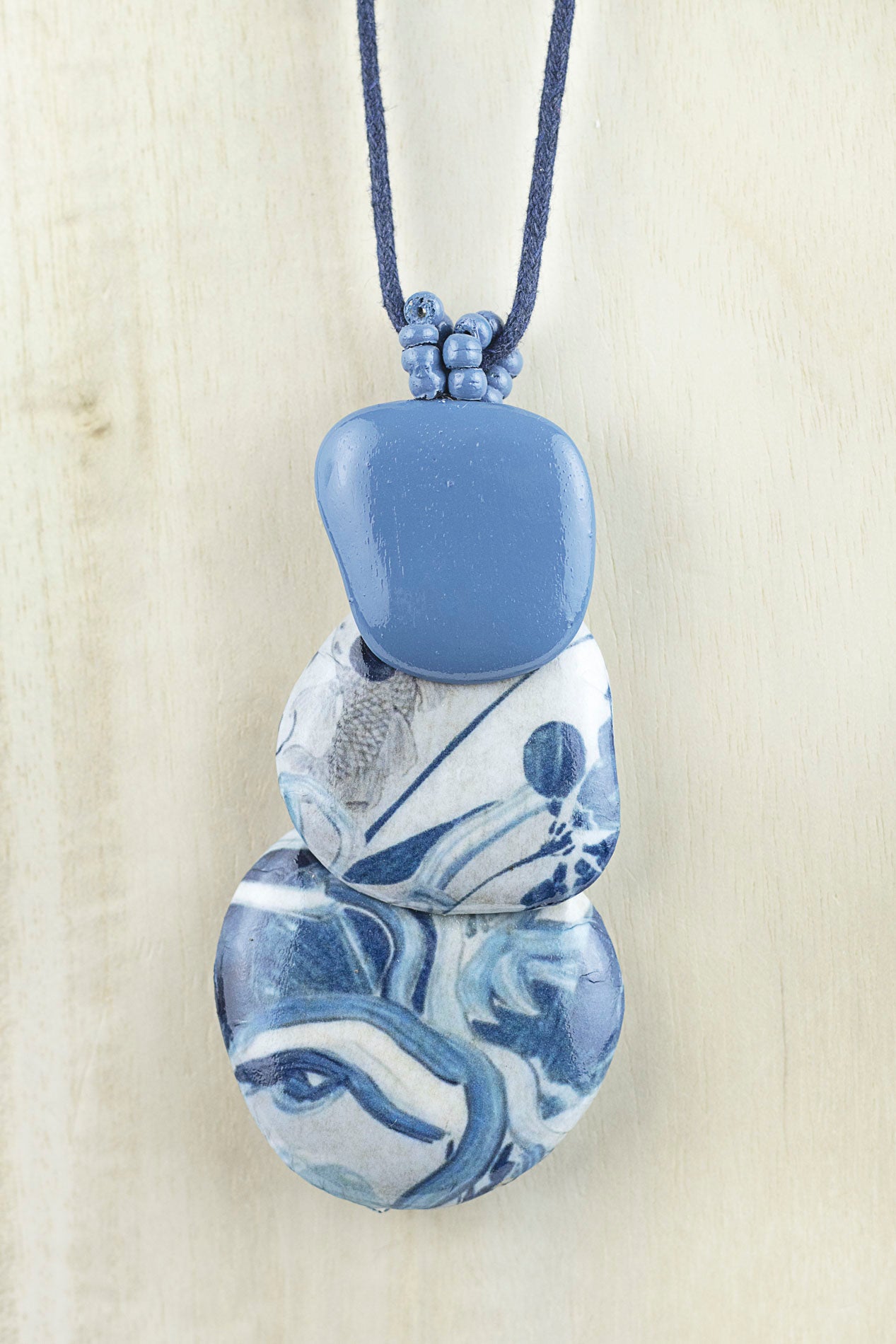 Pendant with three organically shaped pieces