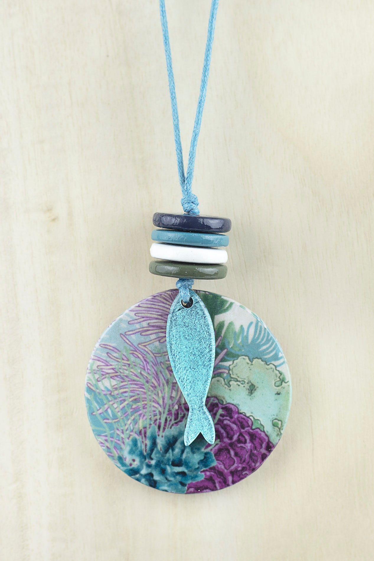 Circular pendant with fish