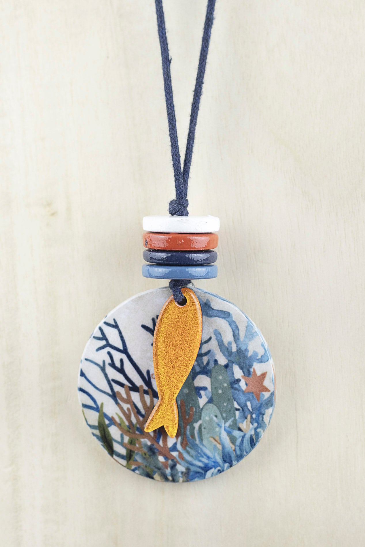 Circular pendant with fish