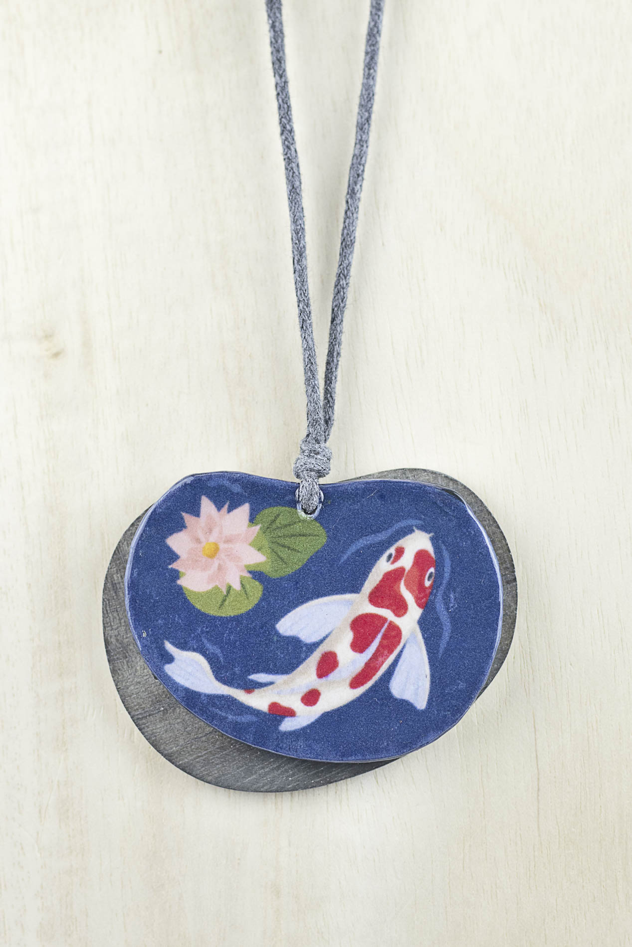 Pendant with fish painting